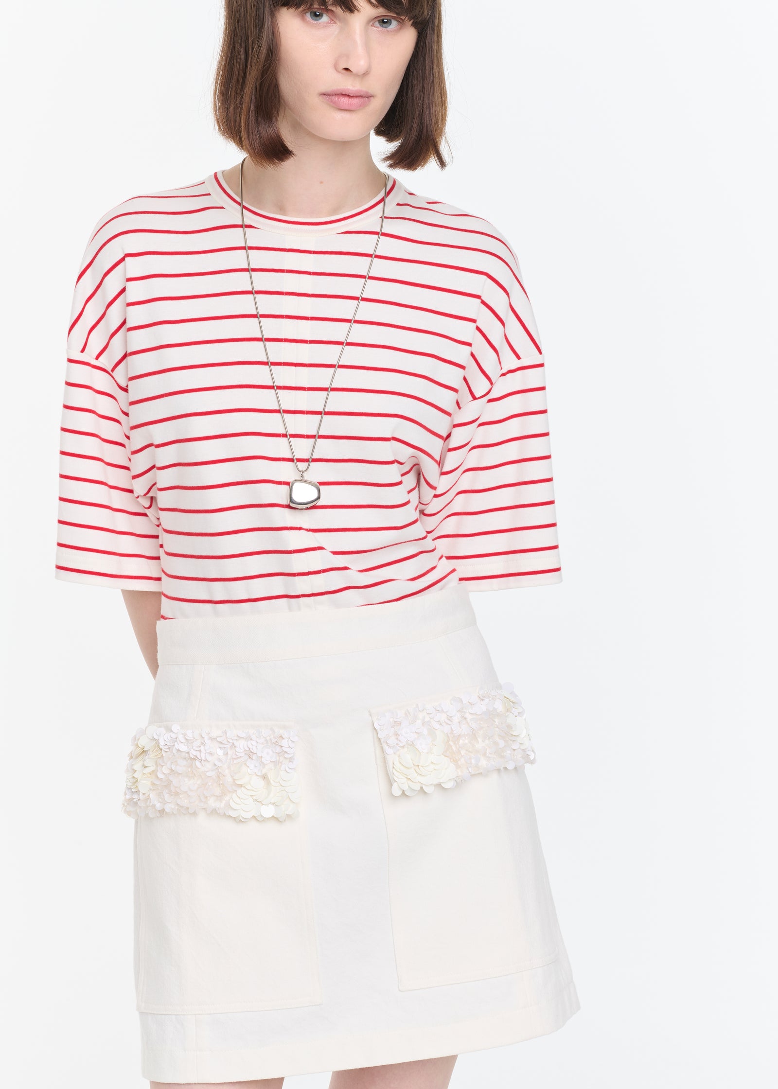 WHITE DRILL MINI SKIRT WITH SEQUINS