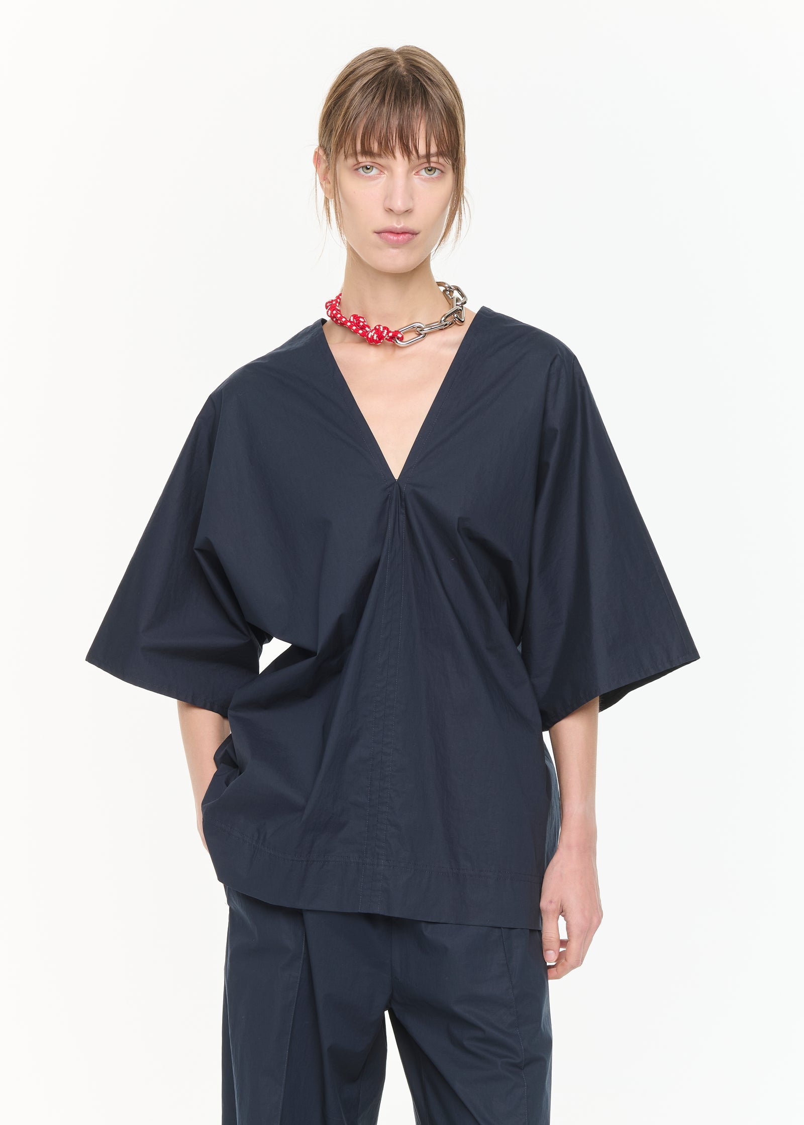 BLUSA CON SCOLLO A V