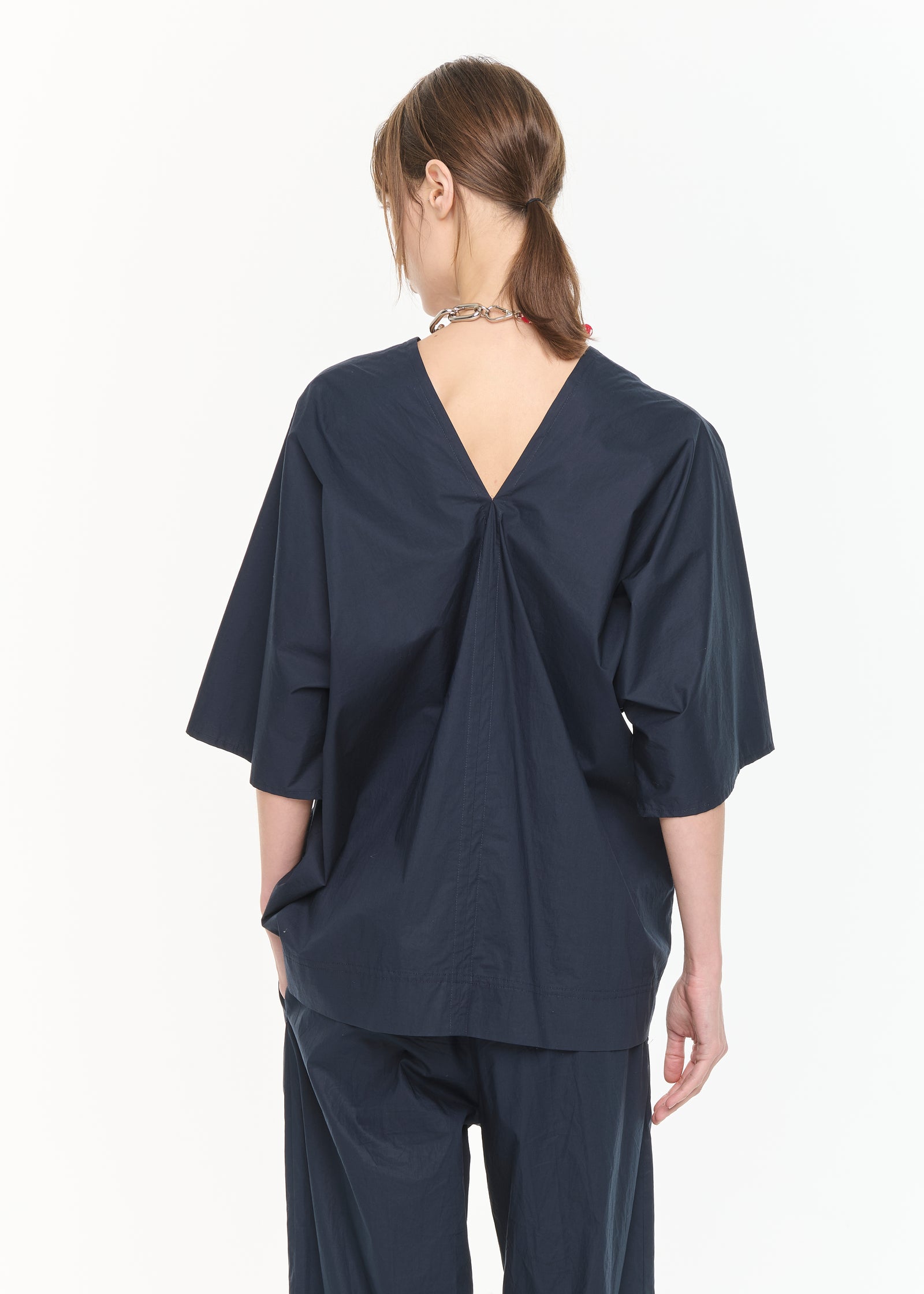 BLUSA CON SCOLLO A V